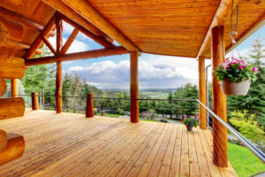 The deck of a wonderful log home.