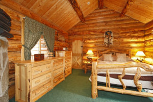 The bedroom in a log cabin.