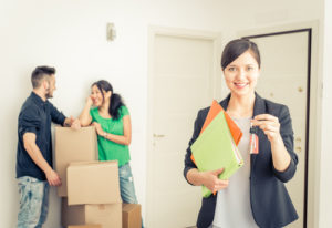 Couple and real estate agent on closing day